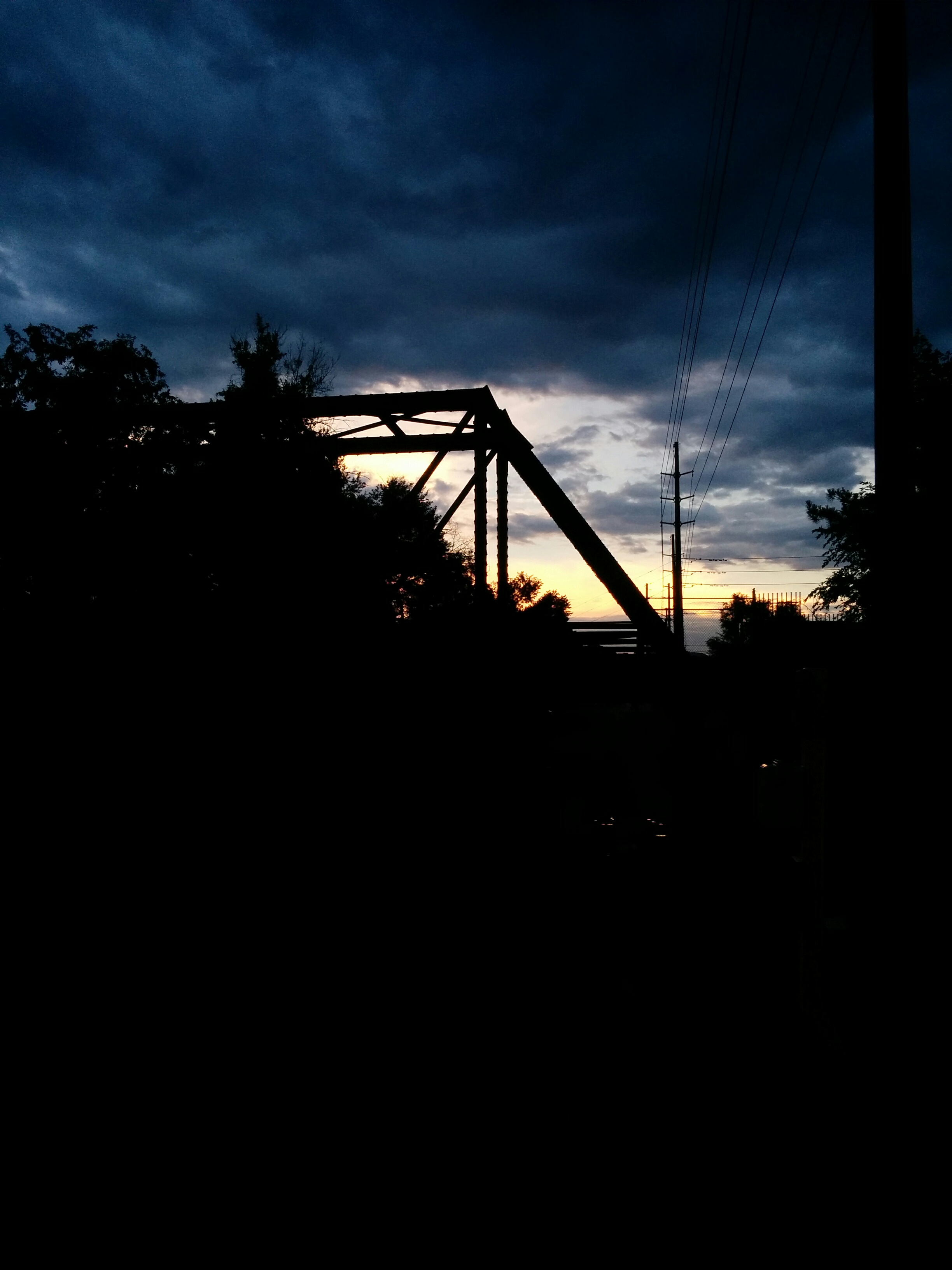 A nice abandoned railway bridge in front of the sunset.